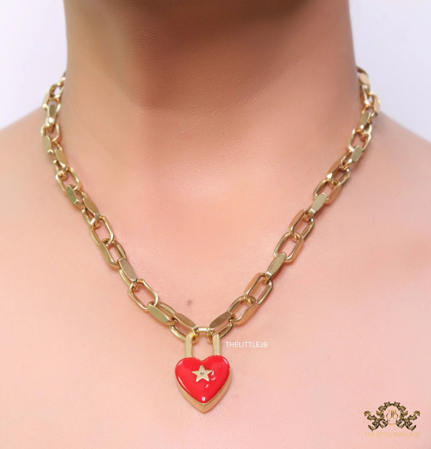 Golden link chain necklace with heart shape lock pendant