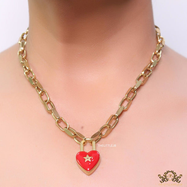 Golden link chain necklace with heart shape lock pendant