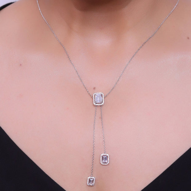 Emerald cut cubic zirconia stones in different sized on sleek platinum plated chain