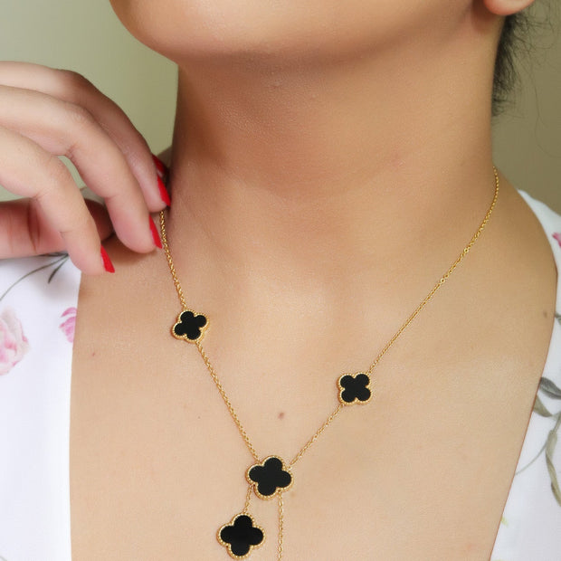 Gold plated necklace set with black enamel coated clovers
