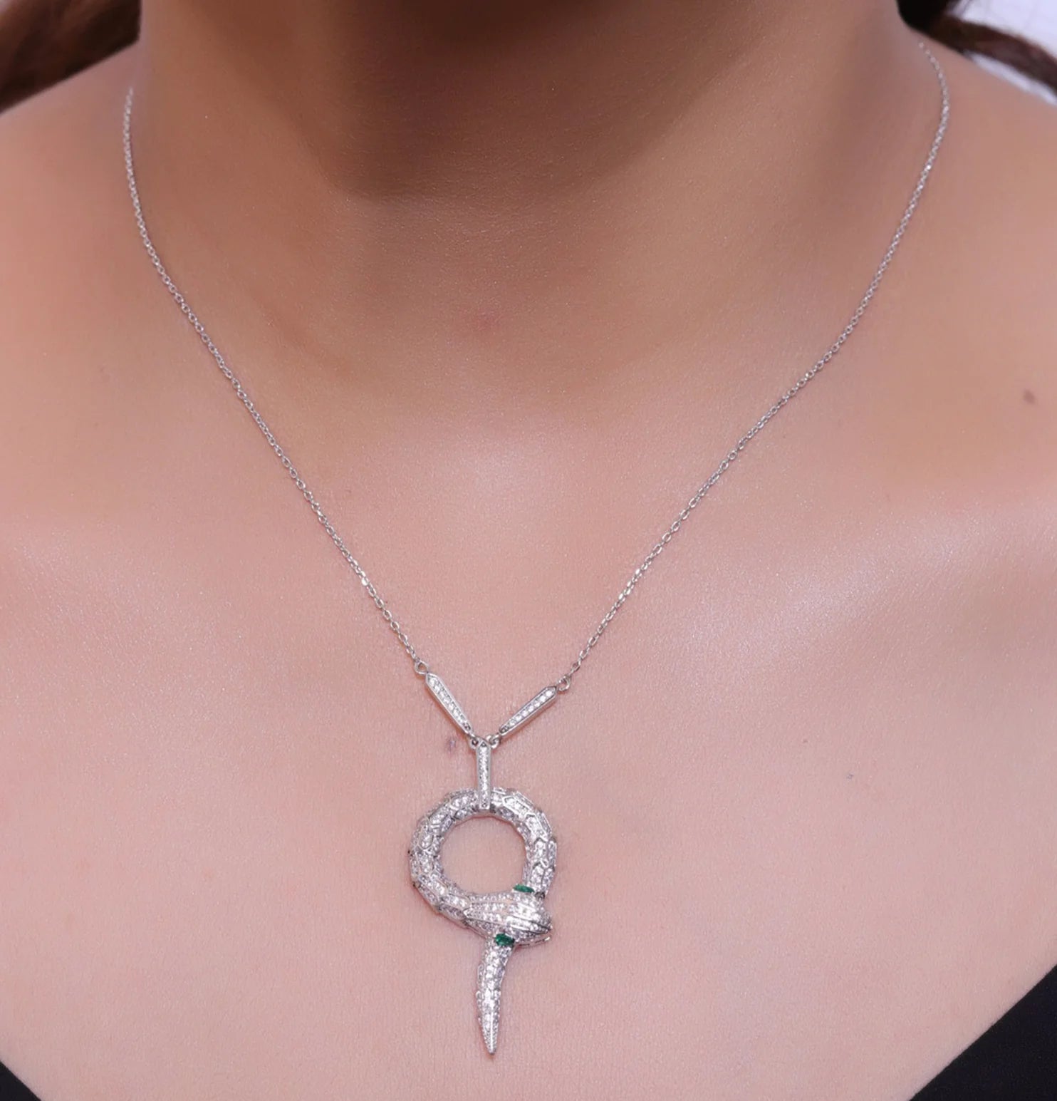 Sleek Platinum plated chain with Platinum plated cubic zirconia ancient serpentine symbol pendant