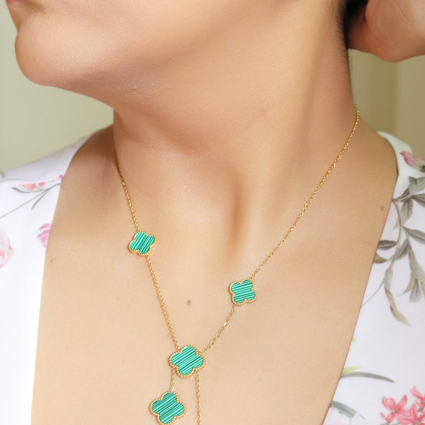 Gold plated necklace set with malachite green clovers
