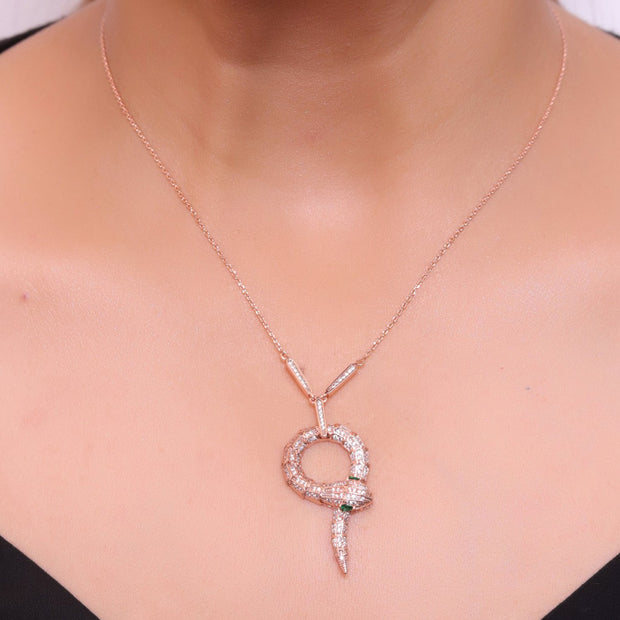 Sleek rose gold plated chain with gold plated cubic zirconia ancient serpentine symbol pendant
