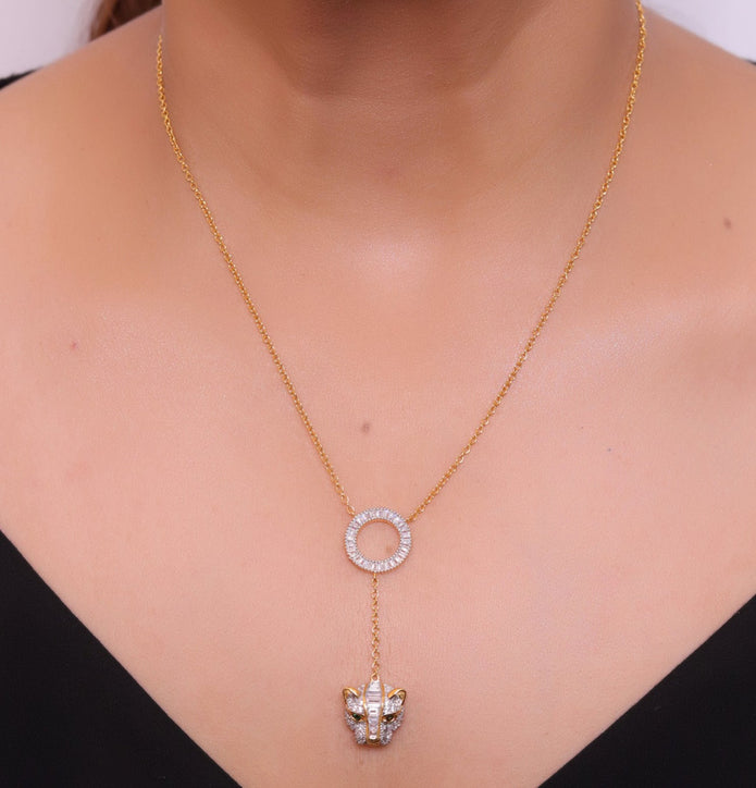 Gold plated sleek chain with circular cubic zirconia disk and gold plated panther face motif pendant