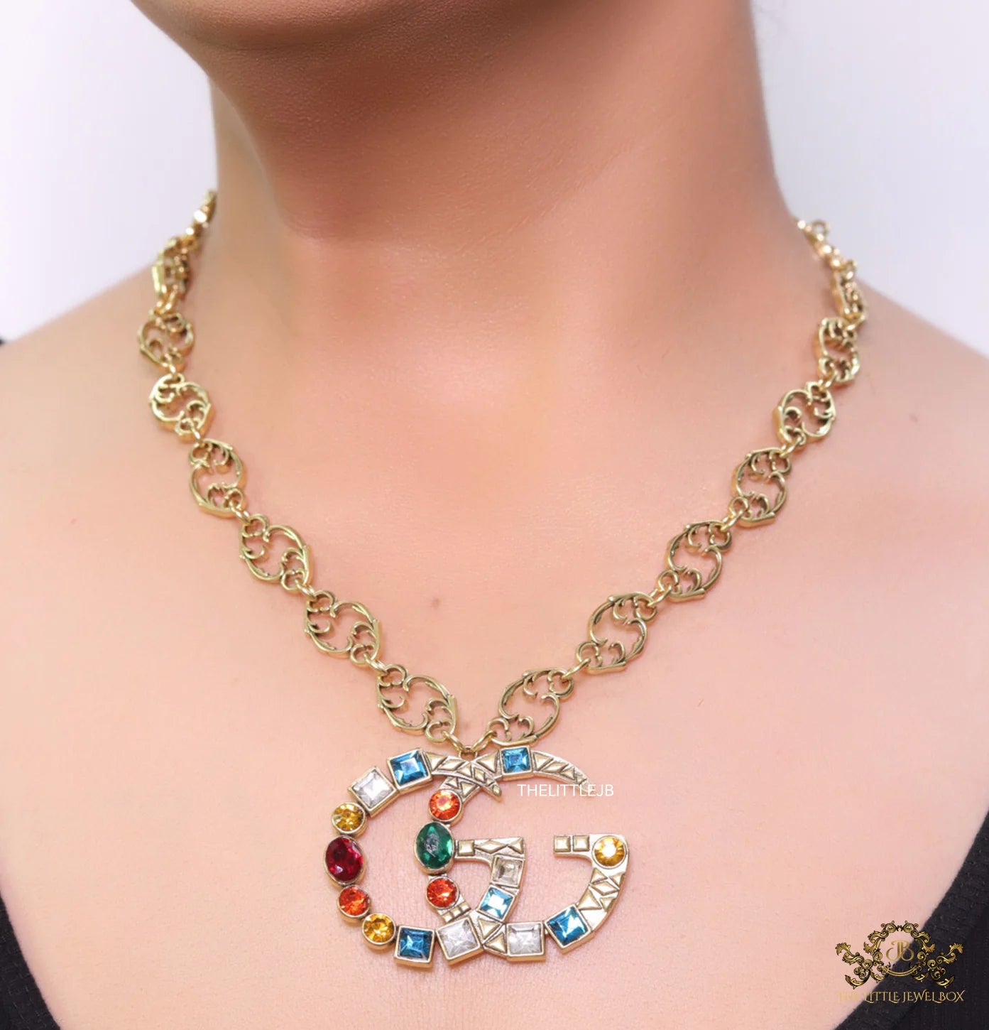 Golden fancy link chain necklace with multi cz twin G pendant