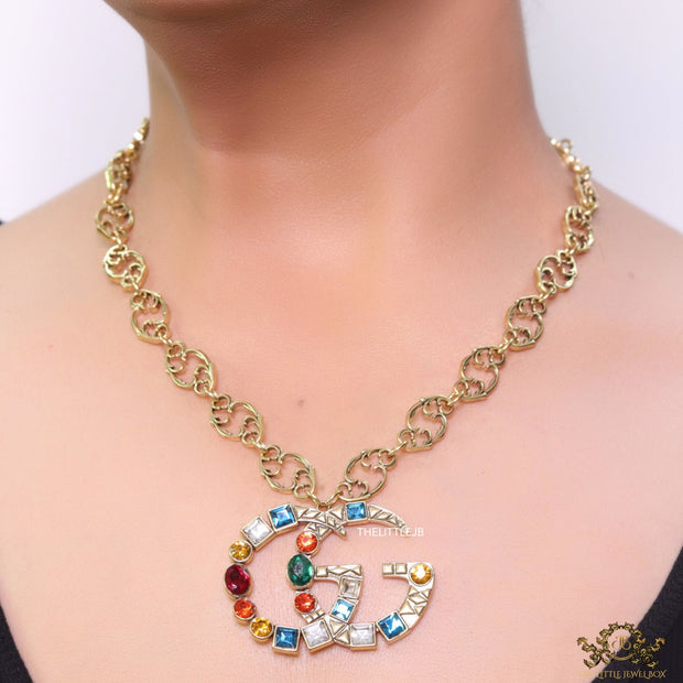 Golden fancy link chain necklace with multi cz twin G pendant