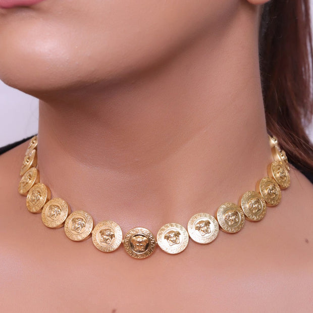 Gold plated embossed Medusa motif on gold circle base necklace