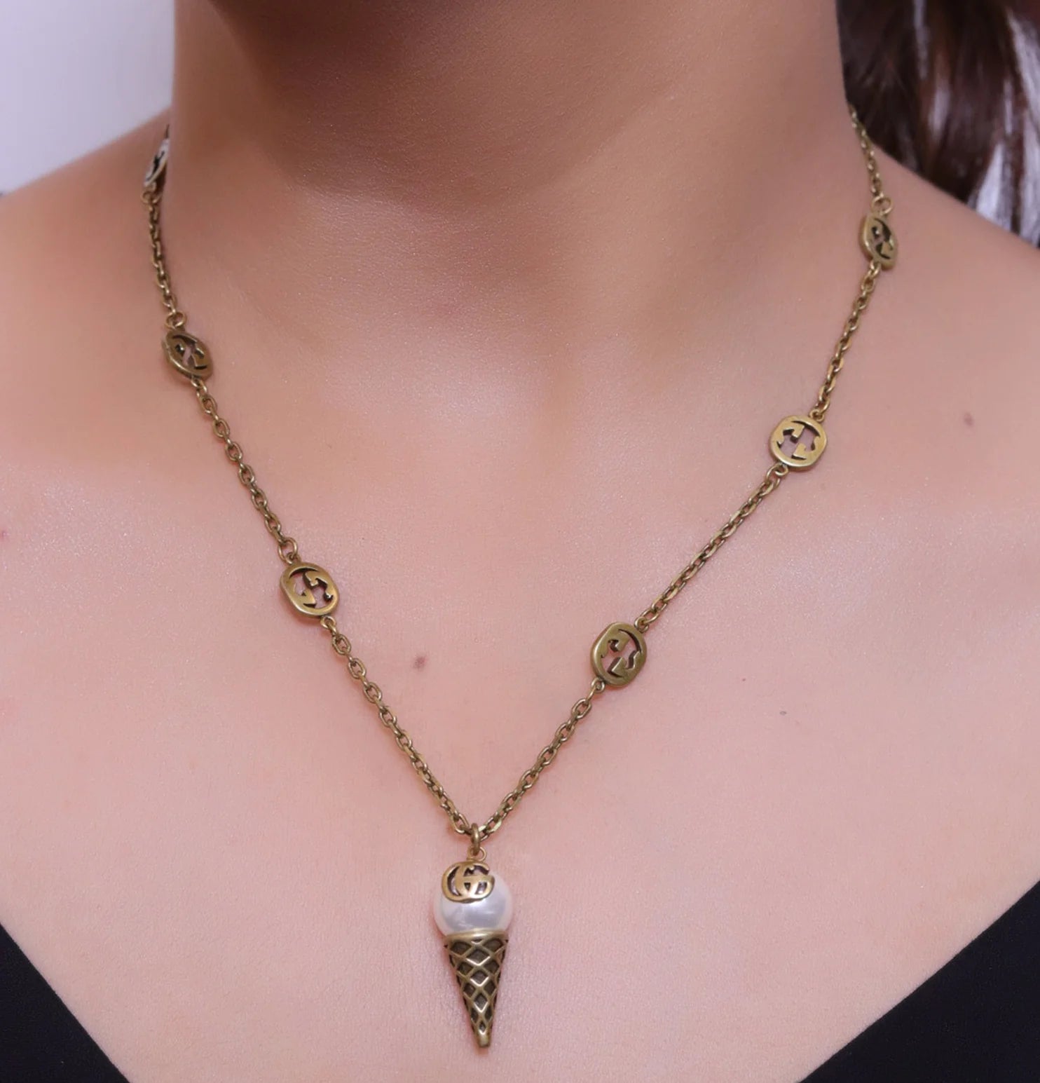 Antique gold plated alphabet motif chain with golden cone pendant