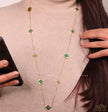Golden chain necklace with malachite green clovers