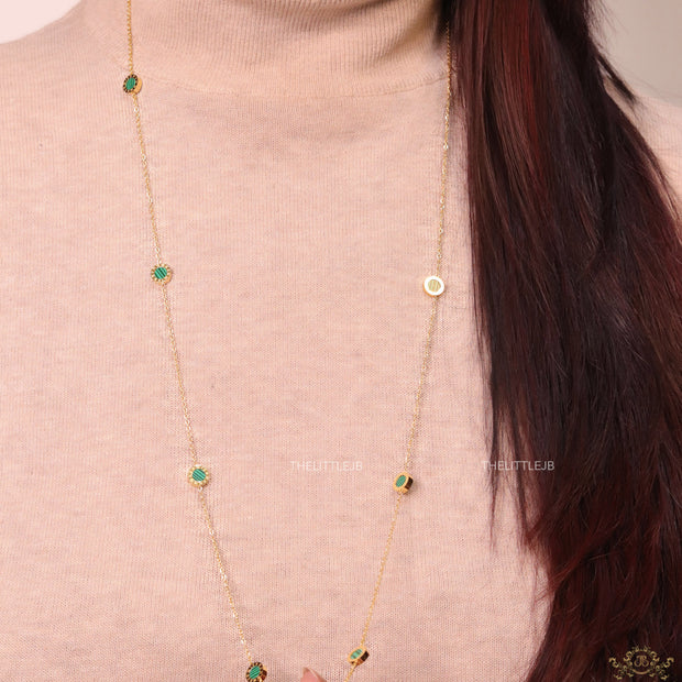 Golden chain necklace with malachite green roman numeral discs