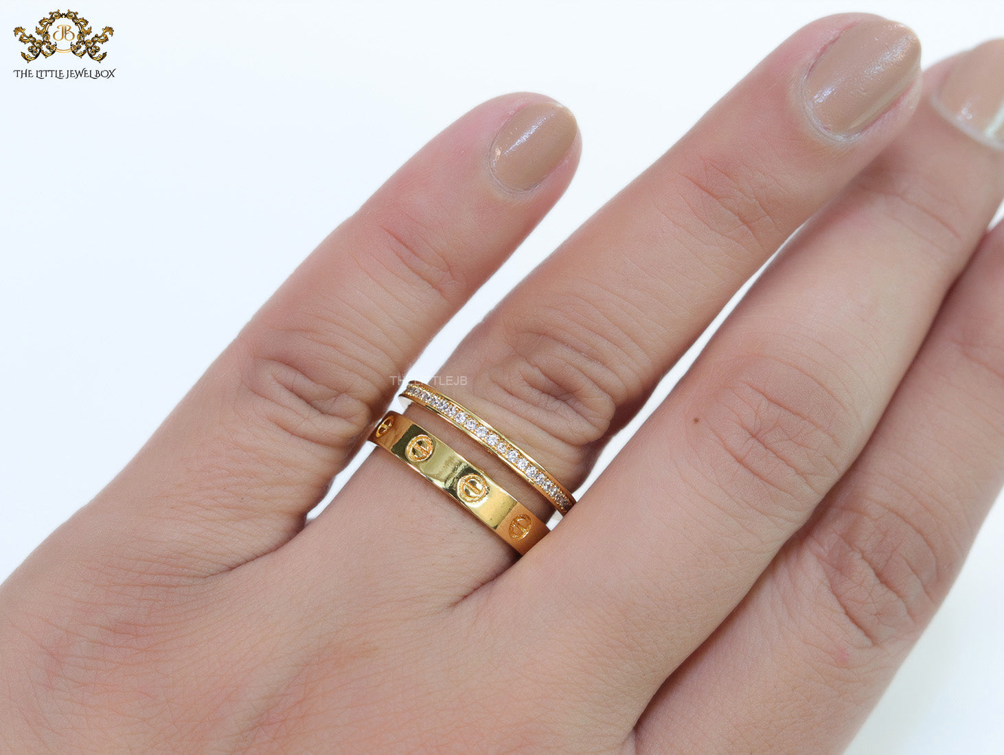 Double layered gold finish open ring with screws and cz