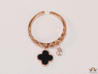 Rose gold plated link chain ring with black clover and cz drop