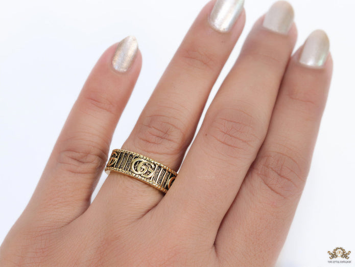 Double G ring band in antique gold finish