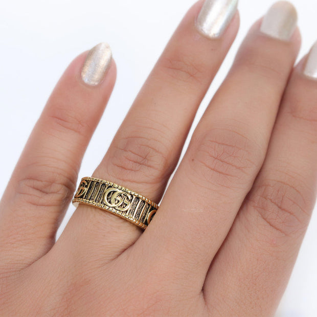 Double G ring band in antique gold finish