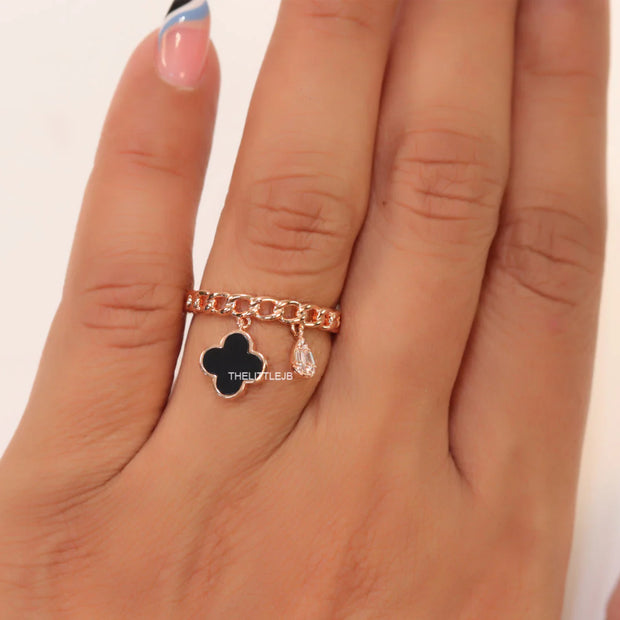 Rose gold plated link chain ring with black clover and cz drop