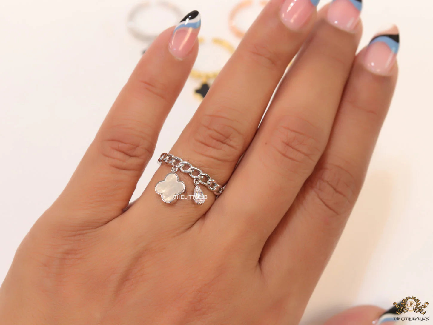 Platinum plated link chain ring with MOP clover and cz drop