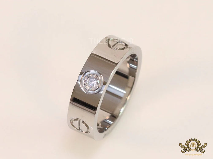 Broad 6mm platinum plated band with screws and stones