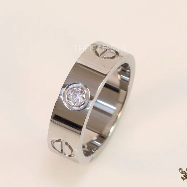 Broad 6mm platinum plated band with screws and stones