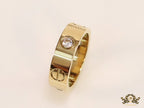 Broad 6mm gold plated band with screws and stones