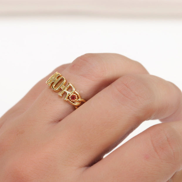 Gold plated alphabet open ring with orange cz