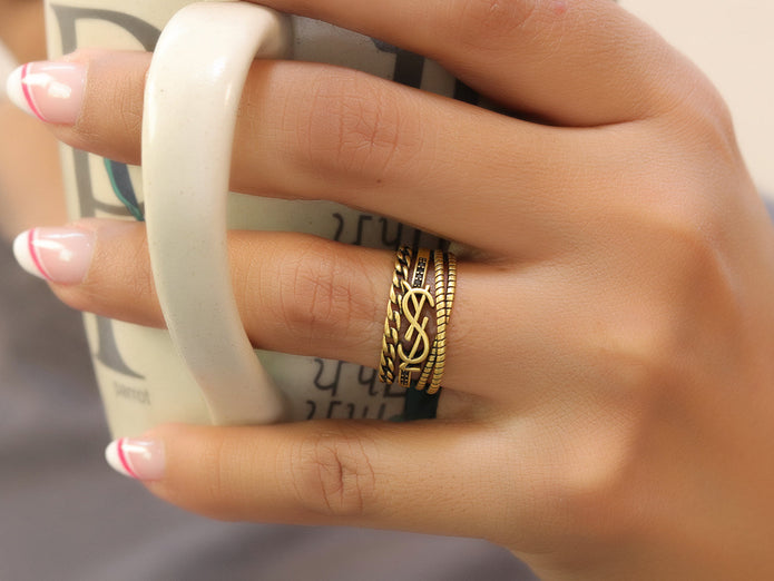 Multilayered open golden ring with alphabet initial