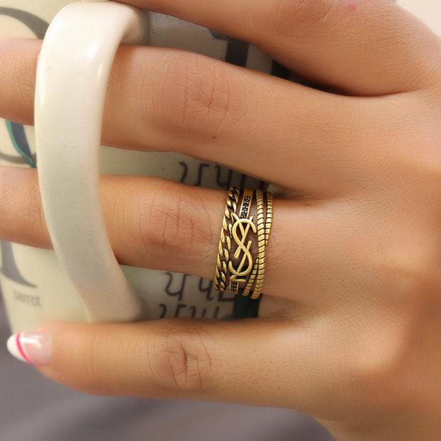 Multilayered open golden ring with alphabet initial