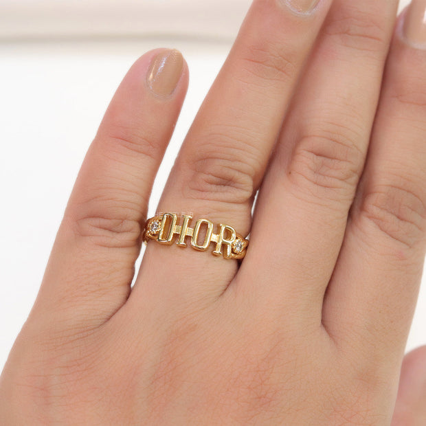Gold plated alphabet open ring with white cz