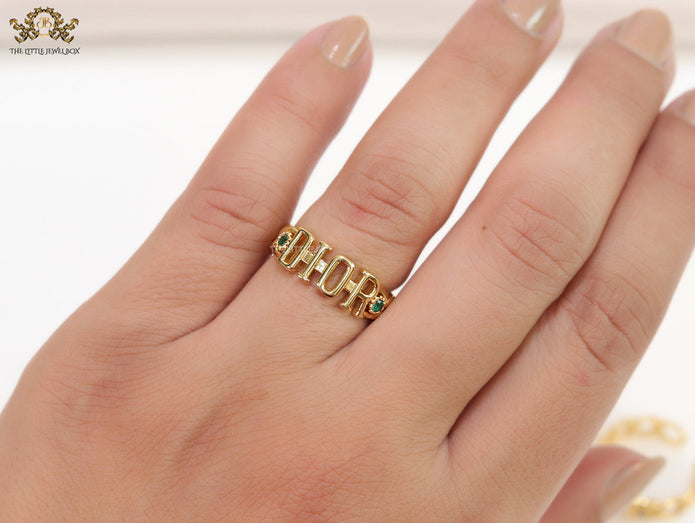 Gold plated alphabet open ring with green cz