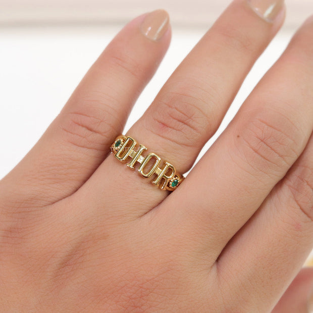 Gold plated alphabet open ring with green cz