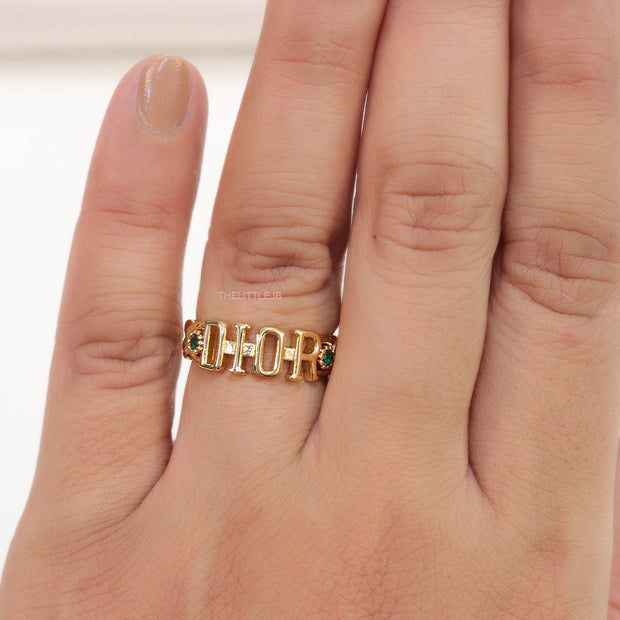 Gold plated alphabet open ring with green cz