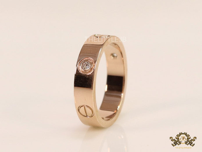 Narrow 4.5mm rose gold band with screws and stones