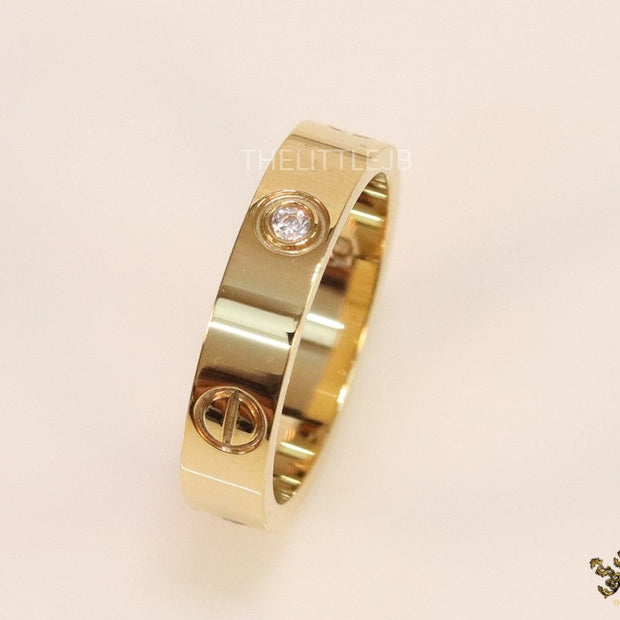 Narrow 4.5mm gold band with screws and stones