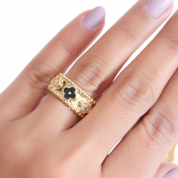Golden ring band with black enamel and cz clovers